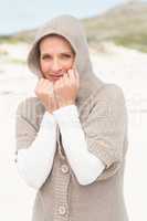 Smiling woman standing on the sand