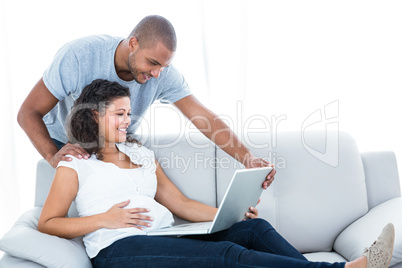 Young couple using laptop