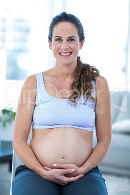 Portrait of cheerful pregnant woman