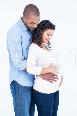 Couple standing against white background