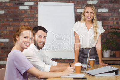 Portrait of cheerful business people during presentation Portrait of cheerful business people during presentation
