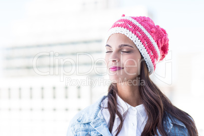 Pretty brunette feeling the air with eyes closed