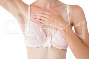 Woman with pink ribbon on her bra for breast cancer awareness
