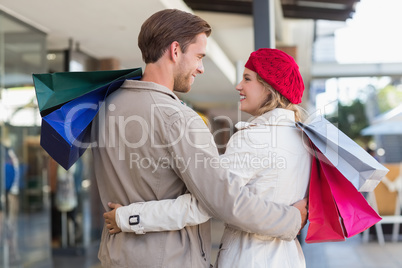 A happy couple with shopping bags