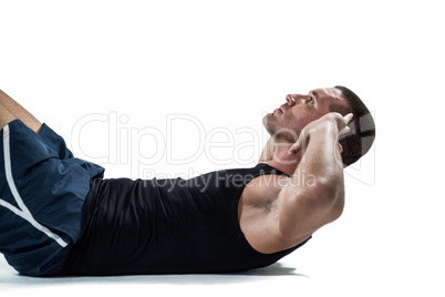 Determined athlete doing crunches