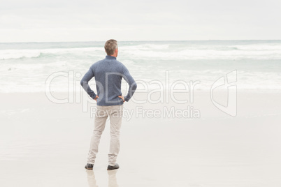 Man standing at the edge of the sea