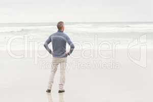Man standing at the edge of the sea