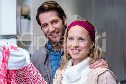 Smiling couple browsing clothes