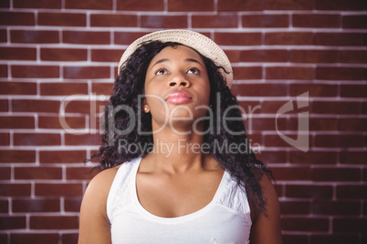 Young woman posing with hat