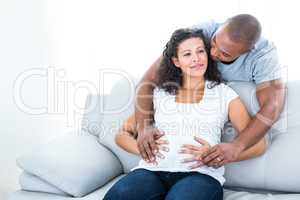 Man and woman touching pregnant belly