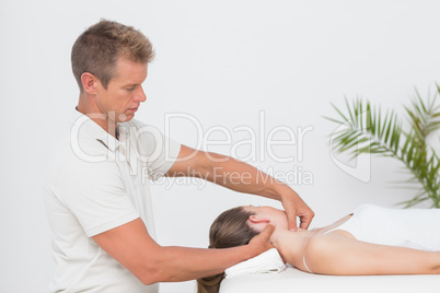 Woman receiving neck massage