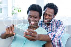 Couple looking at smart phone