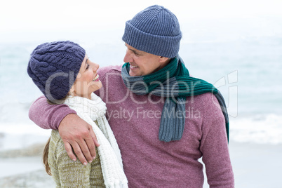 Smiling happy couple hugging each other