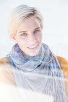 Woman wearing a grey scarf