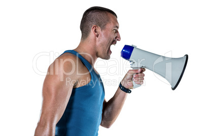 Angry male trainer yelling through megaphone