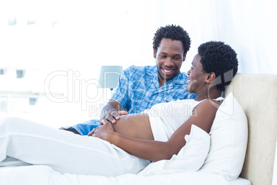Pregnant woman with husband relaxing Pregnant woman with husband relaxing