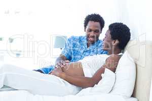 Pregnant woman with husband relaxing