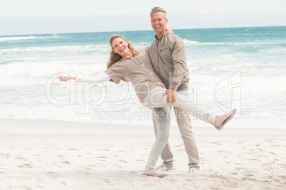 Smiling man holding his partner