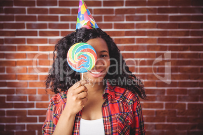 Cute model with hat and lollipop