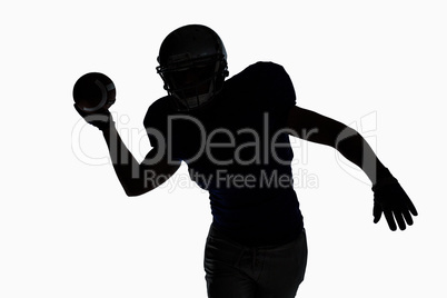 Silhouette sportsman throwing football