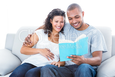 A happy Couple reading a book