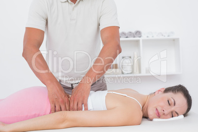 Physiotherapist doing back massage