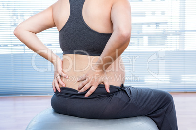 Pregnant woman exercising on exercise ball Pregnant woman exercising on exercise ball