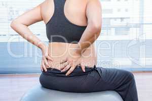 Pregnant woman exercising on exercise ball