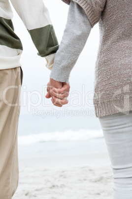 Close up of a couple holdign hands