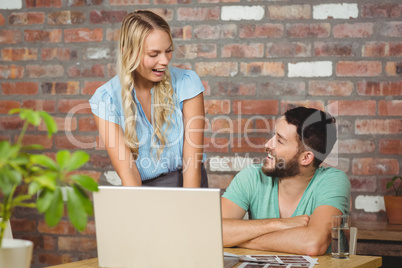 Business people laughing while working