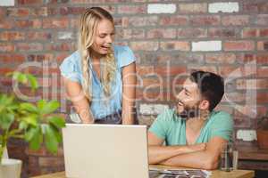 Business people laughing while working