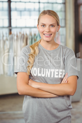 Portrait of beautiful smiling woman with arms crossed