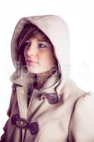 Attractive woman wearing a warm coat with hood raised
