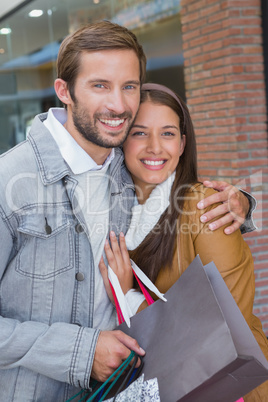 Young couple smiling while looking at the camera