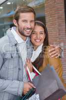 Young couple smiling while looking at the camera