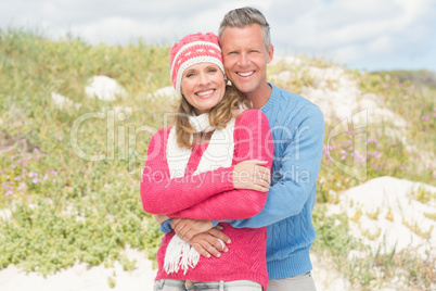 Happy couple standing and holding each other