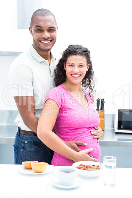 Portrait of couple standing in kitchen Portrait of couple standing in kitchen