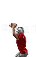 Sports player in red jersey holding ball