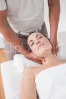 Woman receiving neck massage