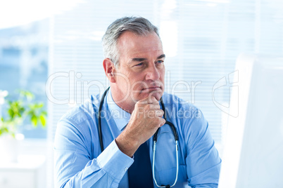 Thoughtful male doctor in hospital