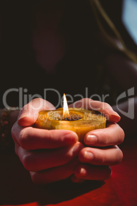 Fortune teller holding a candle