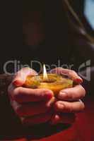 Fortune teller holding a candle