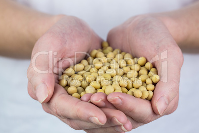 Woman showing handful of chickpeas