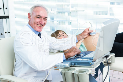 Male doctor doing ultrasound test