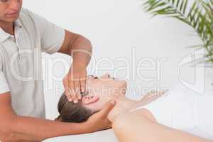 Woman receiving neck massage