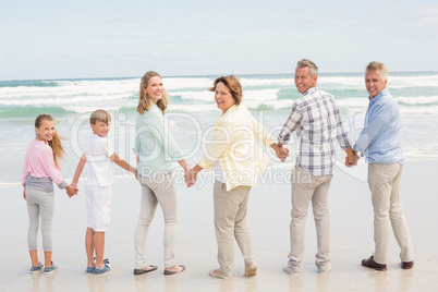 Multi generation family standing beside one another