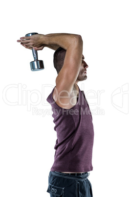 Profile view of athlete working out with dumbbells