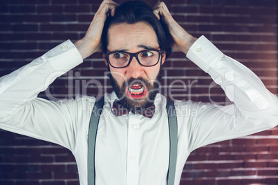 Worried man with head in hands looking away