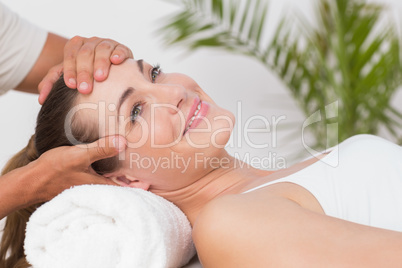 Happy woman receiving neck massage