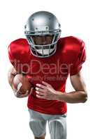 American football player running with ball